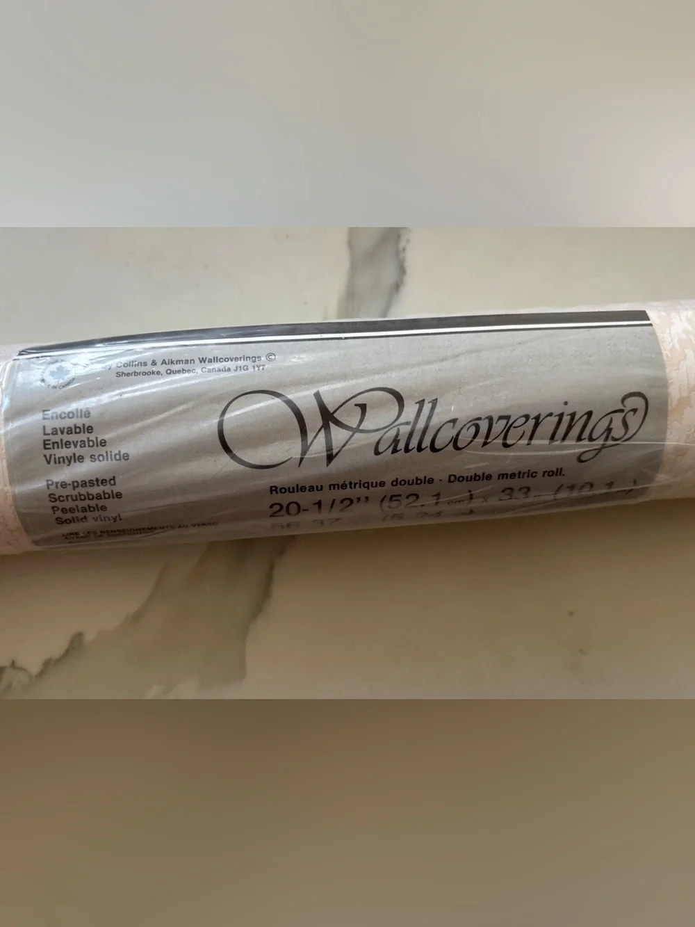 One Roll Wallcoverings wallpaper beige cream abstract design